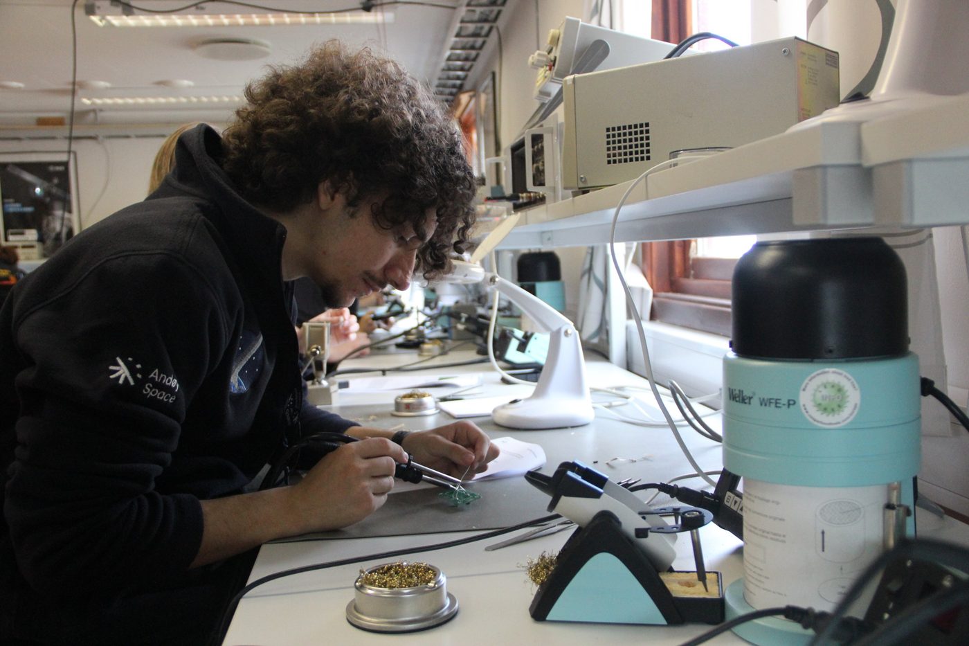 Soldering sensor hardware at European Space Camp